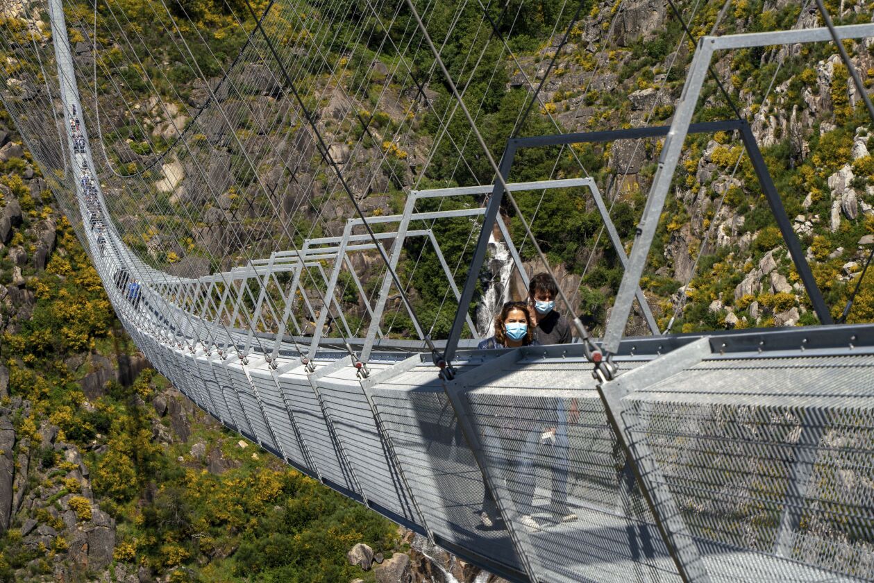 People walk across the newly opened Arouca Bridge.